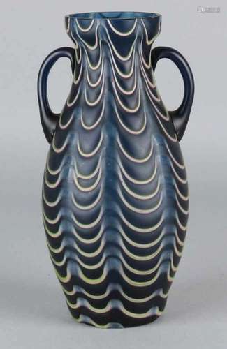 Glass Jugendstil vase in the colors blue-green with white garlands. Unnoticed. Circa 1915. Size: H