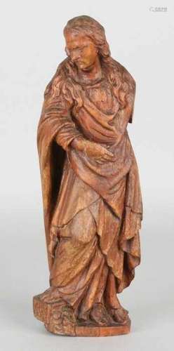 18th Century wood-stoned religious figure. Walnut or lime wood. One arm is missing. Size: 25 cm.