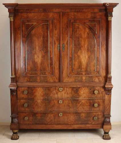 Mahogany Empire cabinet with full columns, brass capitals, panels on the doors, coming forward