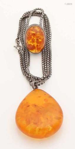 Silver pendant and ring, 835/000, with amber. Pear shaped pendant of amber with silver Venetian