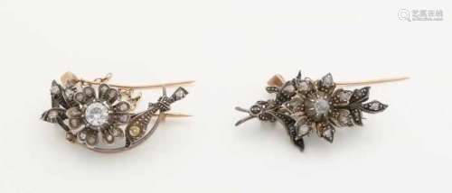 Two gold brooches with silver and diamonds. Two antique brooches with flowers set with diamonds with
