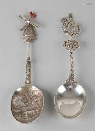 Two silver birth spoons, 835/000, birth spoons with a representation of cows in the trough processed