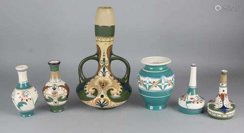 Six times antique Arnhems pottery with floral decor. Consisting of: Three small vases, one large