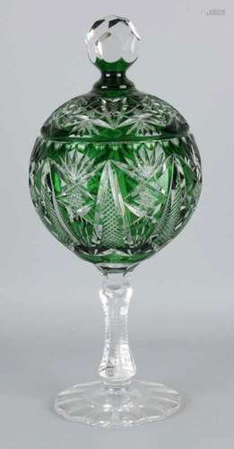 Large old green crystal facetted bonbonniere on high base with lid. 20th century. Size: 40 cm. In