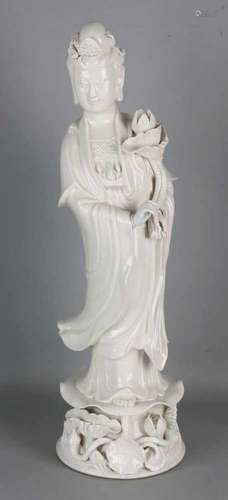 Large old Chinese porcelain Blanc de Chine Quan Yin on lotus flower. With crackle glaze. Hair