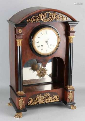 Large Viennese Empire pendulum with cylinder play connected to timepiece. Circa 1820. Four melodies,