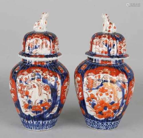 Two 19th century Japanese Imari porcelain lid vases with Foo dogs. One lid restored. Size: 25 x 12