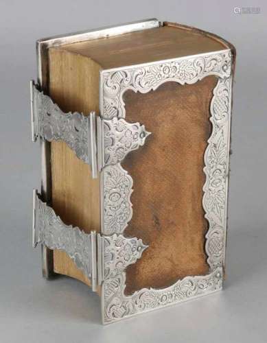 Bible with brown leather cover and gold on cut, decorated with a silver arnd and a double lock.