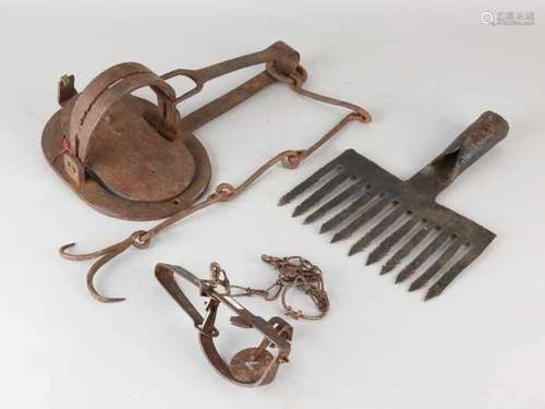 Three times antique ironwork. Consisting of: Two animal clamps and one grip / fish fork? Size: