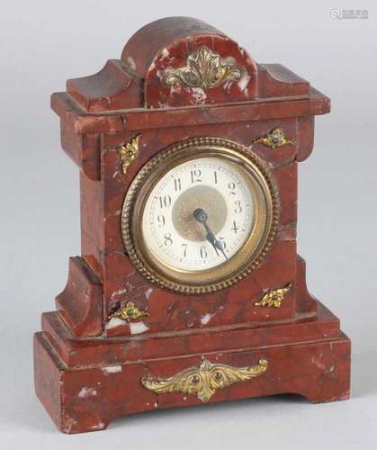 Antique French red-marble alarm clock. Circa 1900. Glued. Size: 16 cm. In moderate condition.