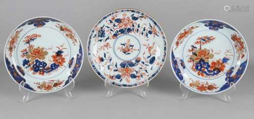 Three times 18th century Chinese porcelain Imari plates with floral and gold decors. One smaller