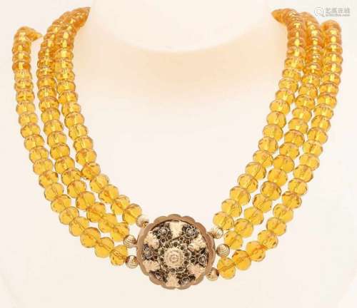Citrine necklace with yellow gold stripe, 585/000. Necklace with 3 rows of faceted citrine beads,