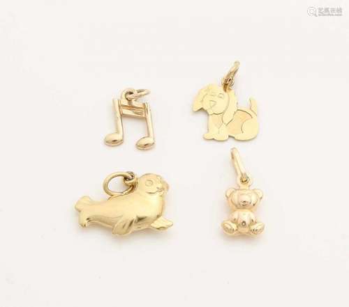 Four yellow gold charms, 585/000, a dog, a seal, musical note and a bear. 10-14mm. Total about 2.3