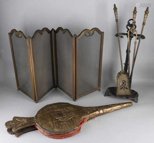 Complete antique brass fireplace set with four-piece trimmings, fire shield and bellows. Size: