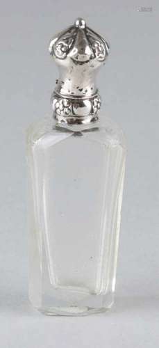 Polished crystal odeyl bottle with a silver 835/000 frame with beautiful cap and floral graphics. MT