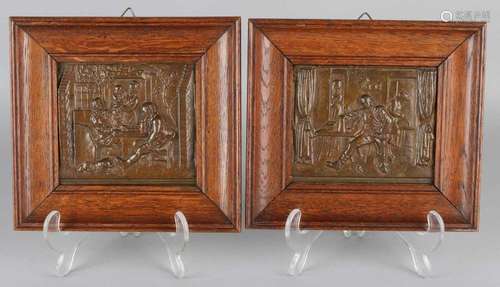 Two antique bronze plaques in oak frames. Interiors with figures. Circa 1900. Size: 10 x 12 cm. In