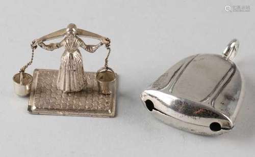 Silver miniature and rattle, 835/000, a miniature of a woman with yoke with buckets and a rattle