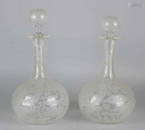 Two beautiful 19th century etched carafes with estate, wild decor and monograms. Size: 30 x 14 cm ø.