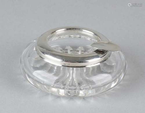 Cut crystal ashtray with a beautiful cut star on the bottom. With silver 835/000 frame. MT .: J.