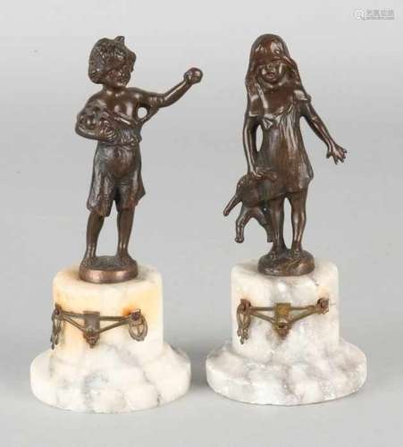 Two antique bronze figures on marble pedestals. Circa 1870. Boy with apples + girl with doll.