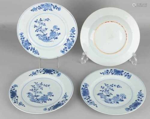 Four times 18th century Chinese porcelain plates with garden decors. Two plates of minimal chips.