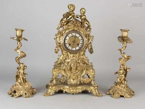 Antique French bronze clock set with putti. With two candlesticks. Circa 1880. With enamel