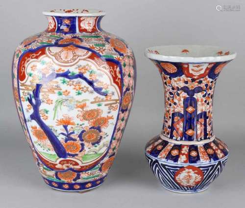 Two large 19th century Japanese Imari porcelain vases with floral, bird of paradise and gold decors.