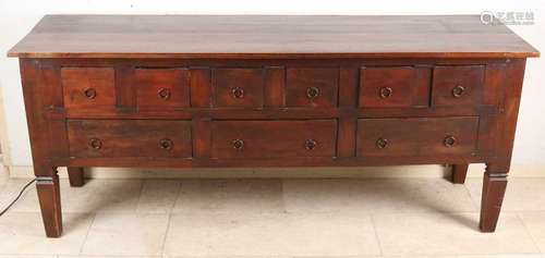 Large mahogany sidetable with nine drawers and ring fittings. Style furniture. Second half of the