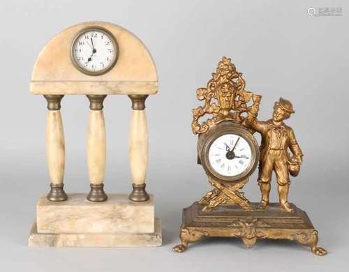 Two antique table clocks with alarm clock. Circa 1900. Once marble with three columns. Once metal