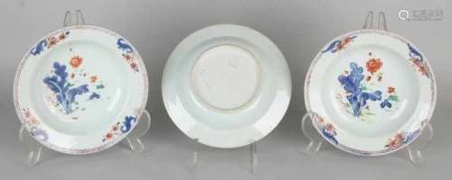 Three times 18th century Chinese Imari porcelain deep plates with garden decor. Two with hairline,