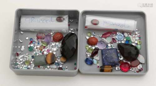 Bag with various gems with various cuts with ruby, opal, amethyst, smoky quartz, laps lazuli and