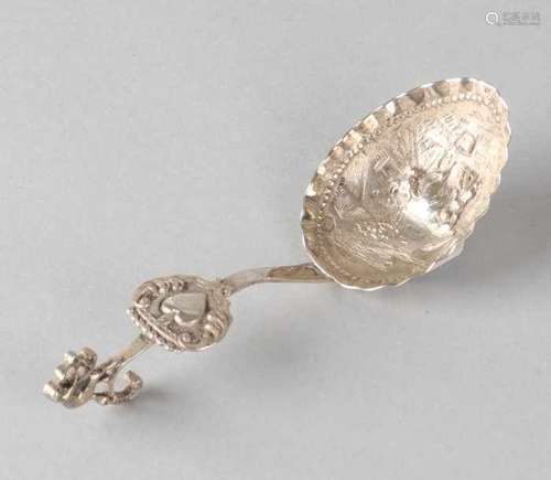 Silver ladle, 835/000, with curled handle crowned with a figure and a shield with heart. The pointed