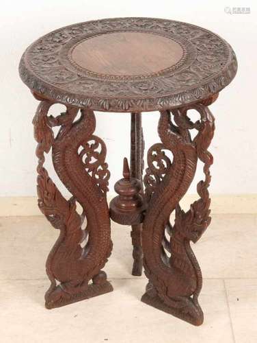 Antique Indonesian teak carved dragon table. Circa 1920. Size: 62 x 46 cm ø. In good condition.