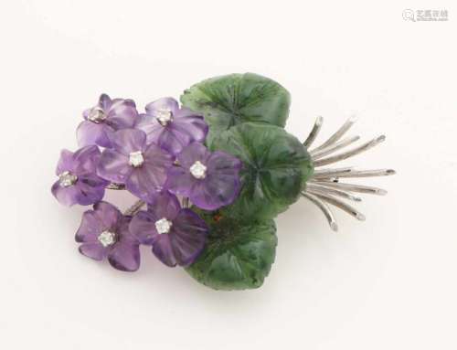 Beautiful white gold brooch, 585/000, with precious stones. Brooch in the form of a bouquet of