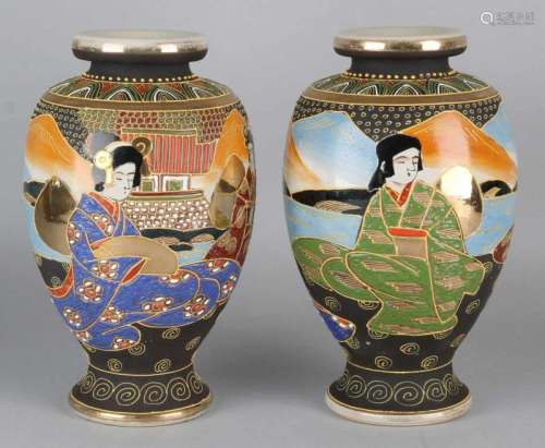 Two old Japanese Satsuma vases with gold decor and geishas. Circa 1930. One vase of hair crack.