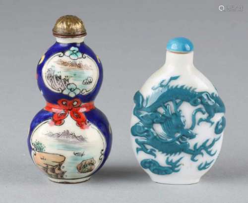 Two times old Chinese snuff bottles. 20th century. Once enamelled, landscapes. One porcelain, blue