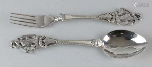 Silver occasion cutlery, 833/000, with fork and spoon with a richly carved handle with cherub cup,