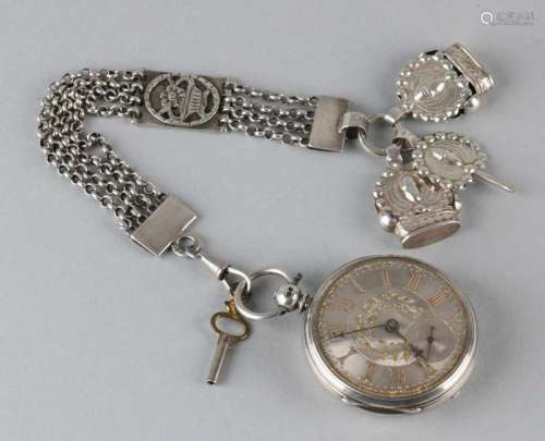 Silver pocket watch with key winding with a silver dial with imposed numbers, complete with
