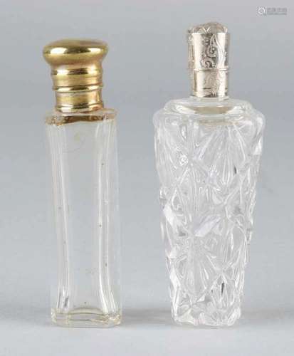 Two crystal odeo vials, one cylindrical model with grinding with silver collar and cap with