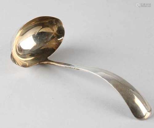 Silver sauce spoon, 833/000, model Haags Lofje with oval bowl with a double spout. MT .: Gerritsen