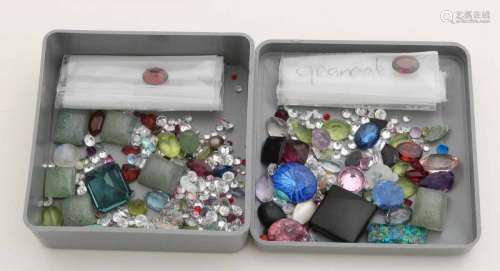 Bag with various gems with various cuts with ruby, opal, amethyst, peridot, garnet and onyx. Total