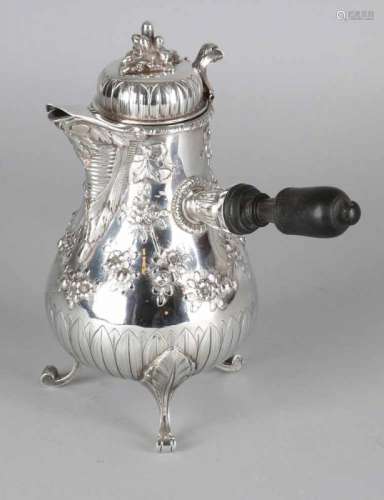 Silver jug, 950/000, in Louis XVI style, decorated with bows and flowers. placed on 3 curling legs