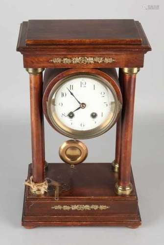 Antique walnut portal pendulum with brass ornaments. Circa 1900. Eight-day movement, half-hour