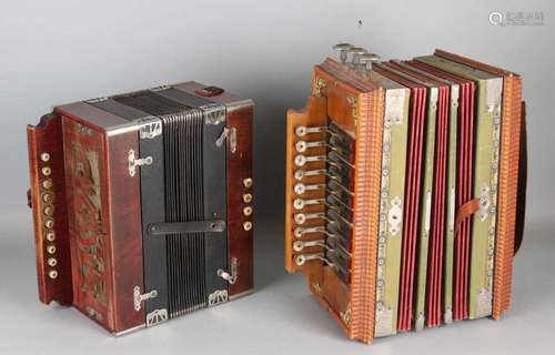 Twice antique German accordions. Circa 1900. Once marked Apollo. Size: 21 x 35 x 19 cm. In