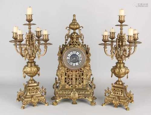 Antique French bronze pendulum with enamel cartouches. Clock has eight-day clock, spring garland.