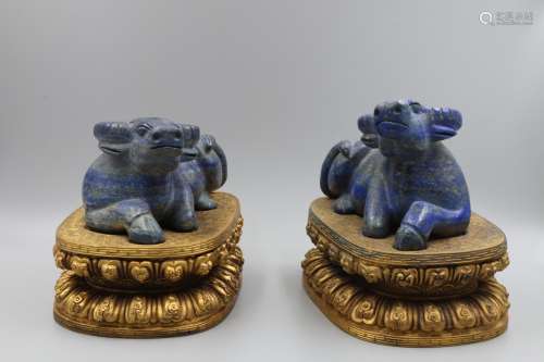 A PAIR OF LAPIS LAZULI CATTLES WITH BRONZE STAND