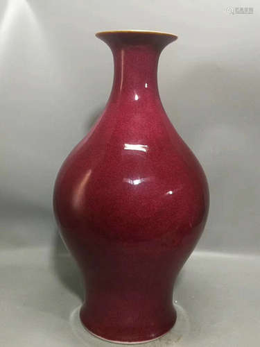 A RED GLAZED GUANYIN VASE