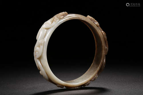 HETIAN JADE CARVED 'CHILONG' ROUND ARM BANGLE