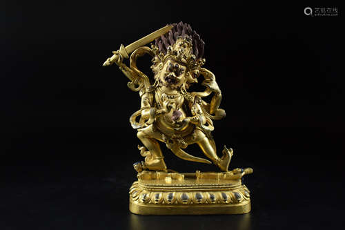 GILT BRONZE CAST 'FOUR-ARM WRATHFUL DEITY' FIGURE