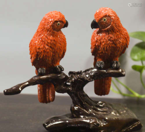 A RED CORAL CARVED PARROT